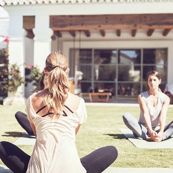 Group of women engages in a yoga session at Marbella Club Hotel