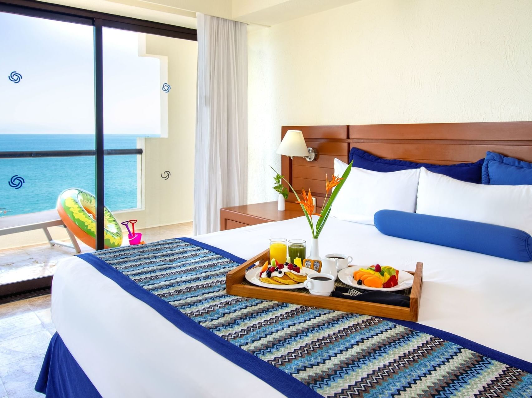 Breakfast served on the bed in 2 Bedroom Family Suite, Ocean View at Plaza Pelicanos Grand Beach Resort