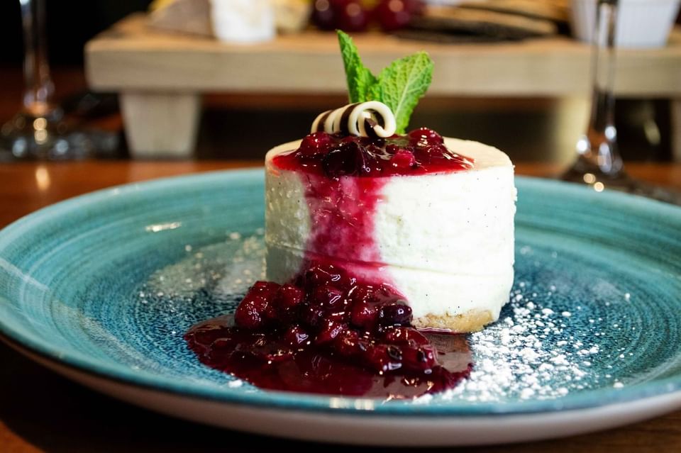 Individual cheesecake with berry compote and mint at Gott's Bar & Kitchen, The Met Hotel Leeds, England