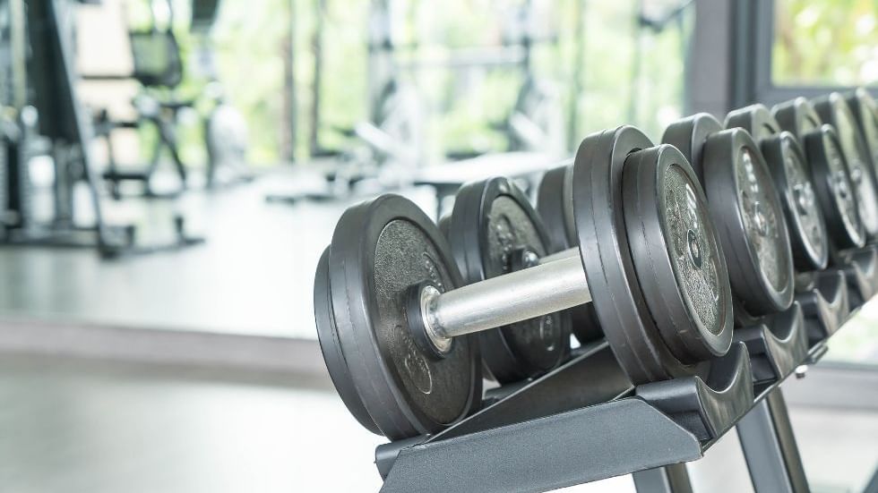 Rack of dumbbells in a gym with exercise equipment at Sunway Hotel Big Box