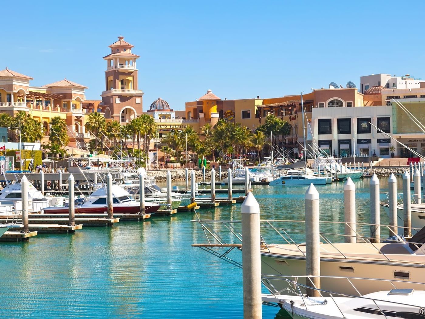 Boats stationed in Puerto Paraíso dock, La Colección Resorts
