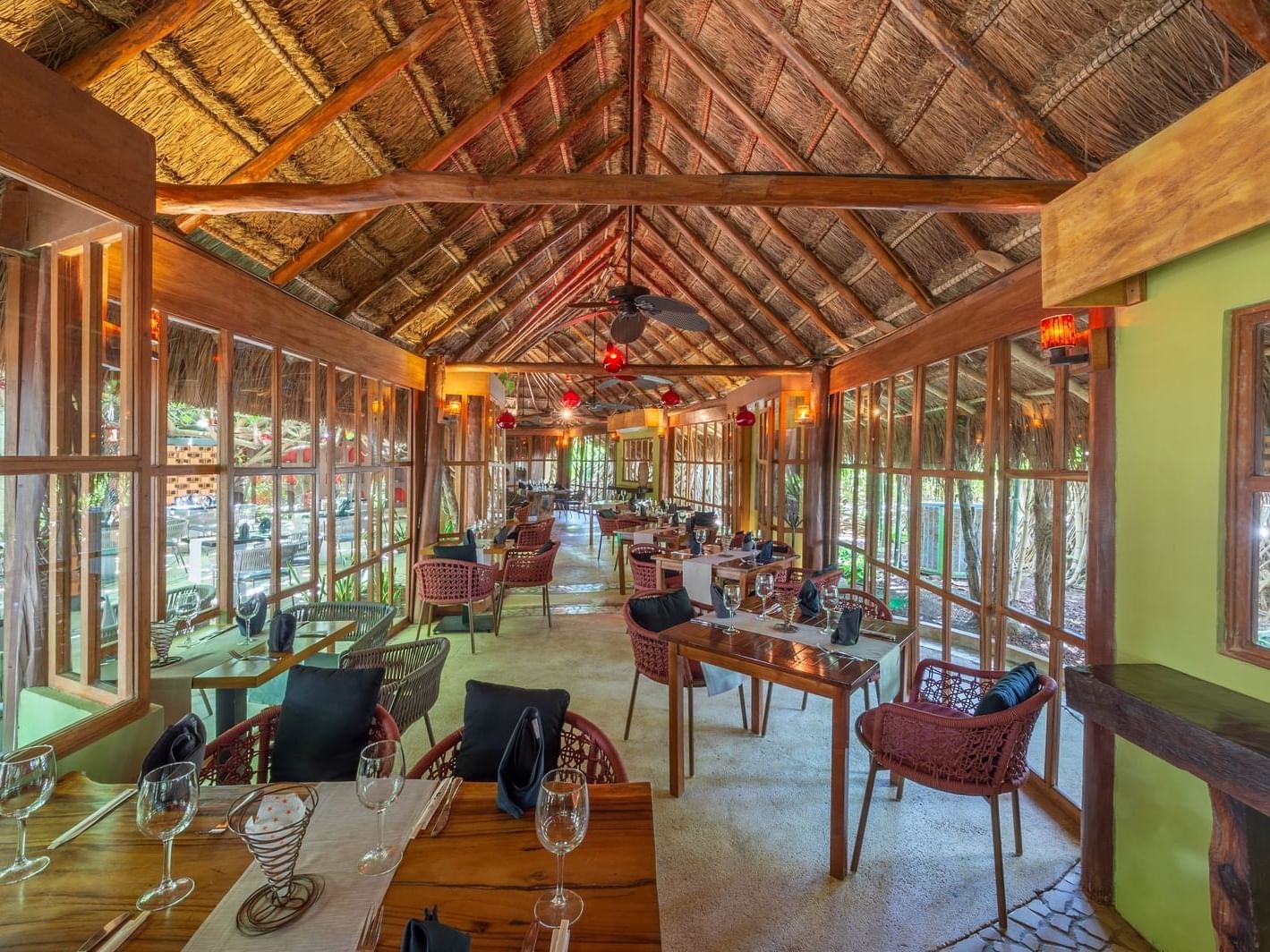 restaurant dining room with straw canopy roof