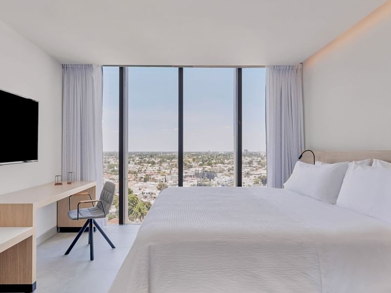 Large bed & city view in Relax Suite at IOH Freestyle Hotels