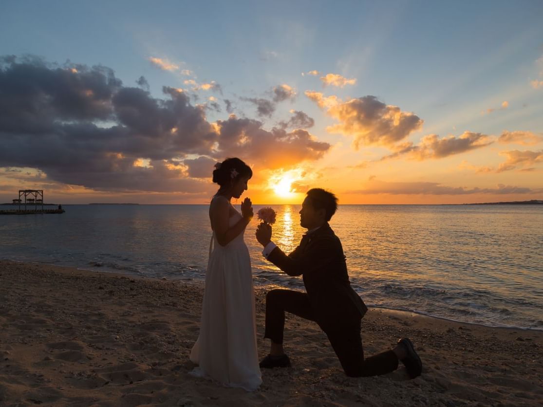 Marriage proposal on the beach at sunset near Grand Coloane