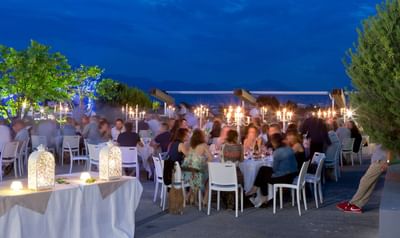 Outdoor evening dining with guests at Starling Hotels in Lausanne Switzerland
