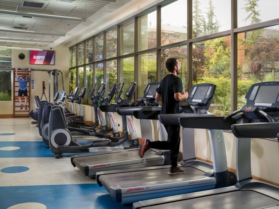 man running on treadmill