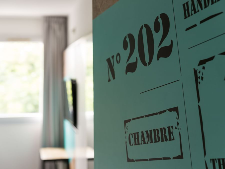 A wall with room number in Hotel Clermont-Ferrand Nord