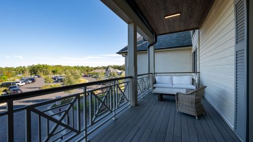 Comfy balcony lounge area overlooking the carpark in King Room With Balcony at Camp Creek Inn