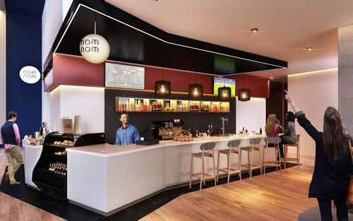 Bar stools by the Nom Nom Camara Bar counter at One Hotels
