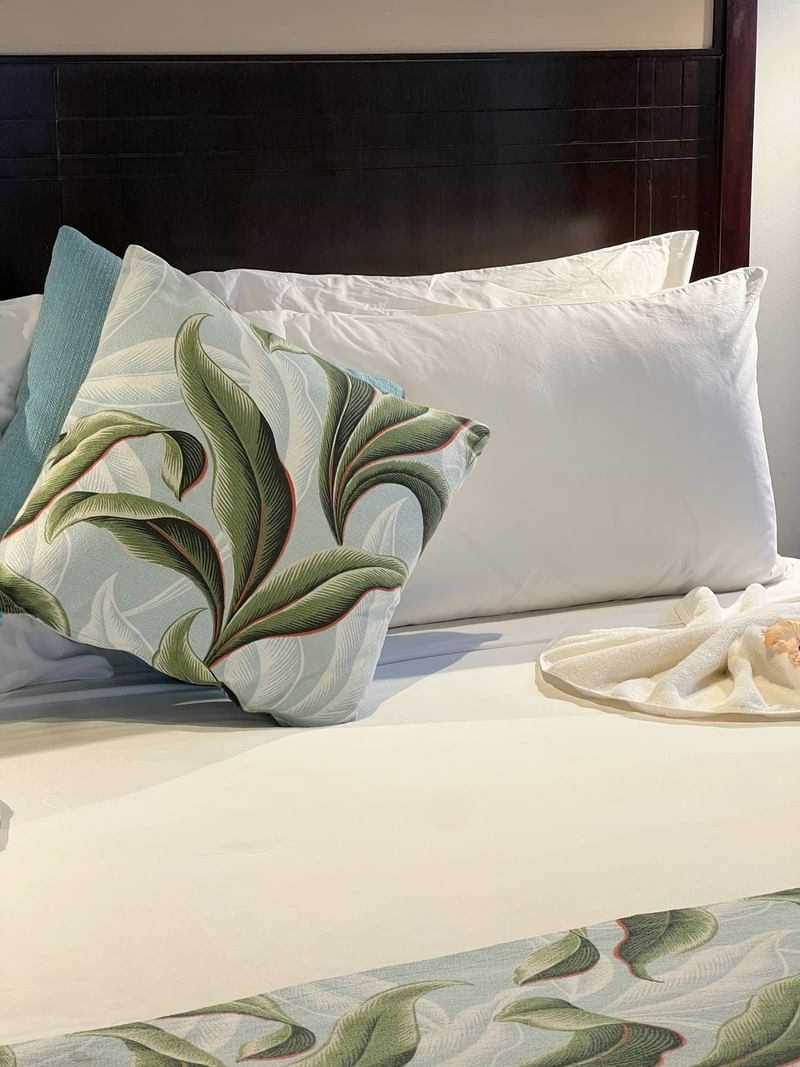 Comforter and pillows on a bed in the Ocean View Villa at Tambua Sands Beach Resort Sigatoka.