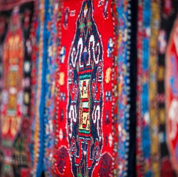 Close-up of a red carpet design in a market near Titanic Port Bakirkoy