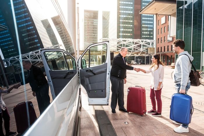 Driver greeting his passengers