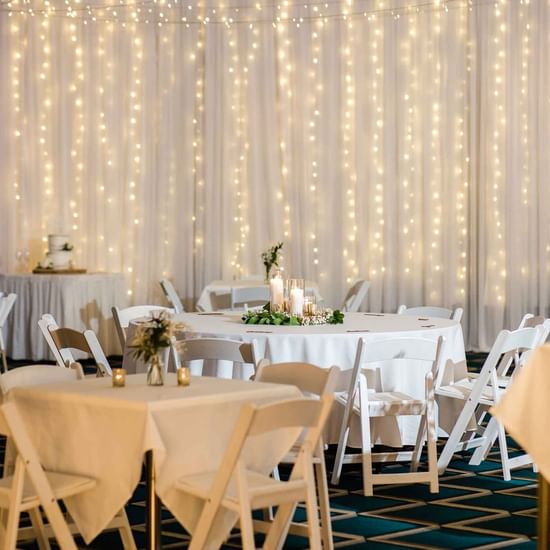 Dining tables arranged for the wedding ceremony at Pullman Magenta Shores