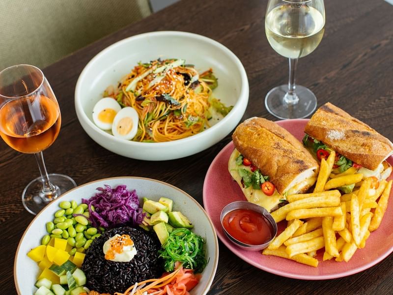 Assorted gourmet dishes with wine in restaurants at Crown Hotels