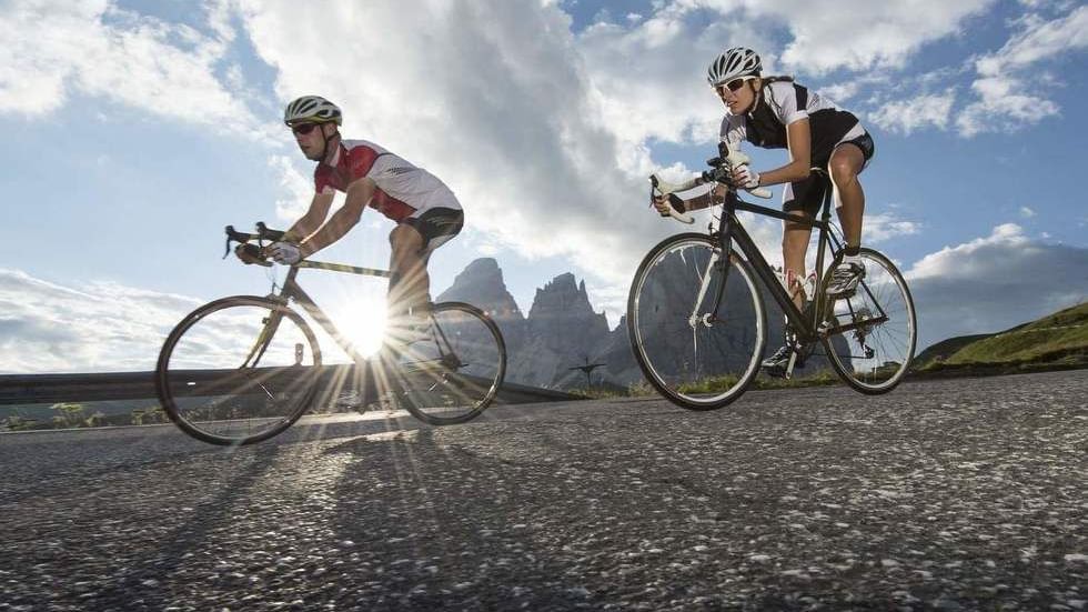 Low-angle shot of 2 bikers on a road near Falkensteiner Hotels