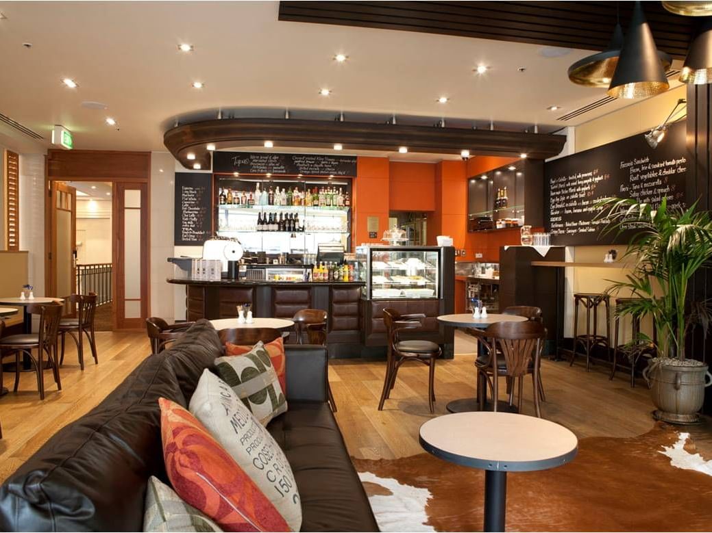 Up Café lounge area at The Sebel Quay West Suites Auckland