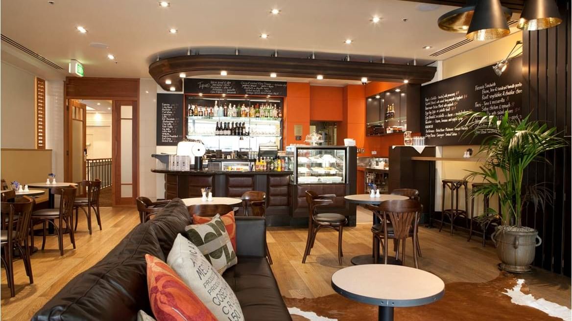 Up Café lounge area at The Sebel Quay West Suites Auckland