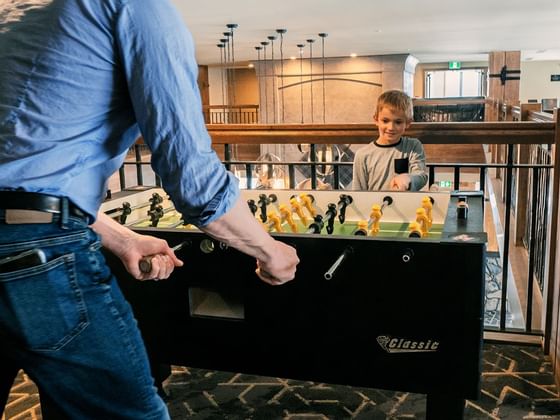 A father and kid playing at The Malcolm Hotel