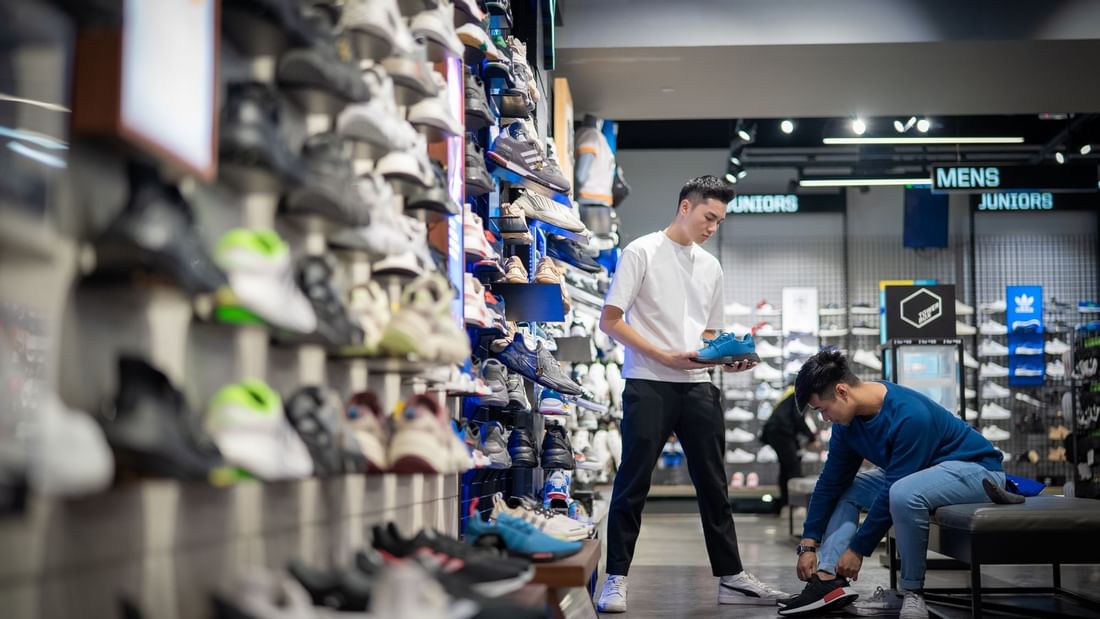 Man trying a shoe in a shop near Sunway Resort