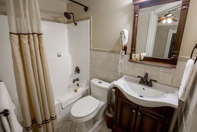 Bathroom vanity in 2-Queen Beds Room at Horton Grand Hotel
