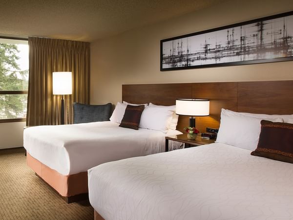 Two beds in modern hotel room