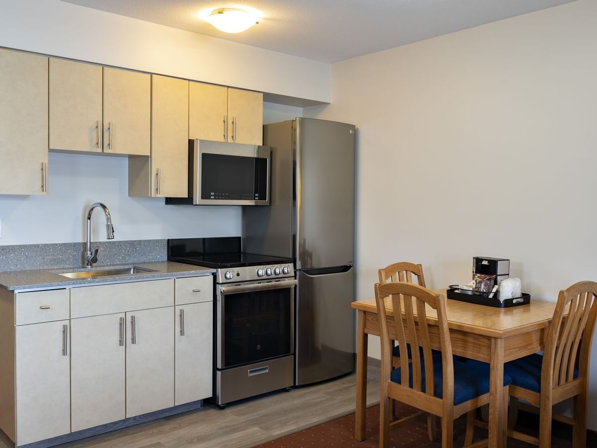 Kitchen and dining table in hotel suite