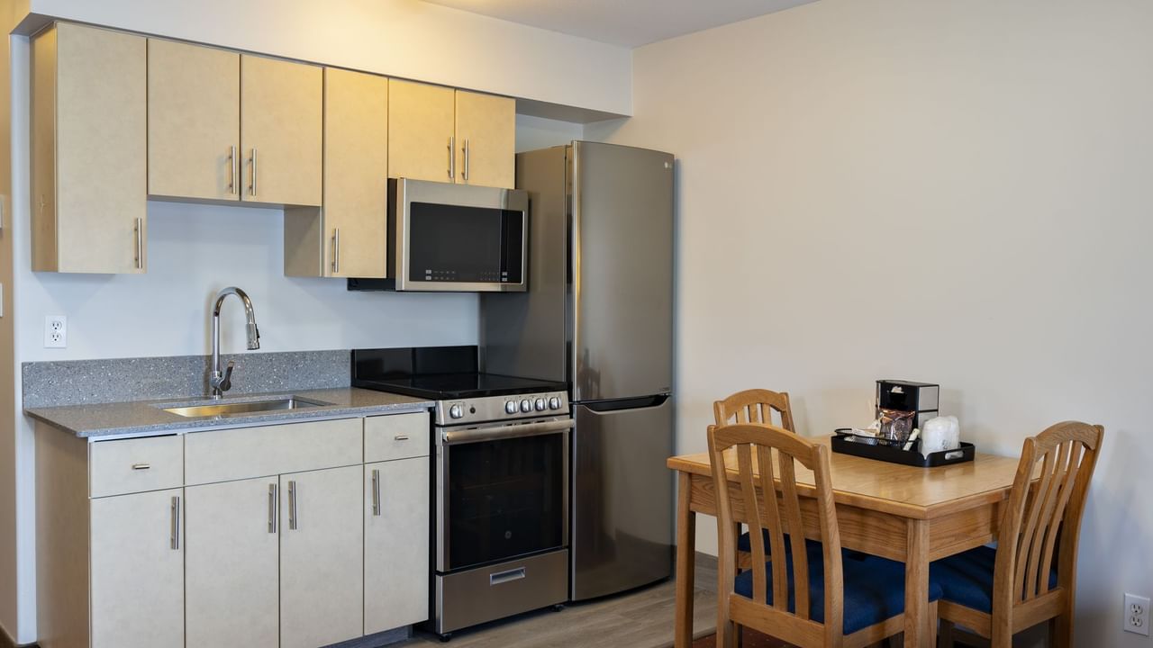 Kitchen and dining table in hotel suite
