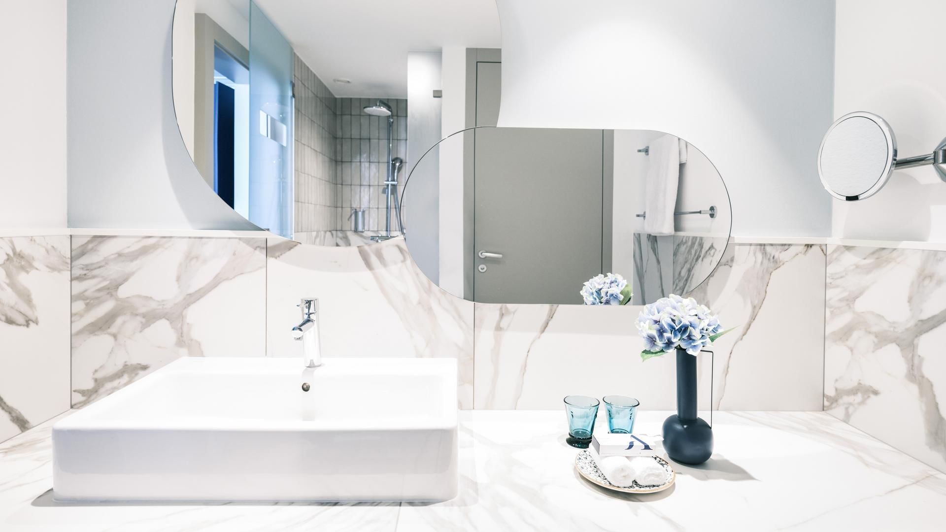 Bathroom vanity in Family Deluxe Room at Falkensteiner Hotels