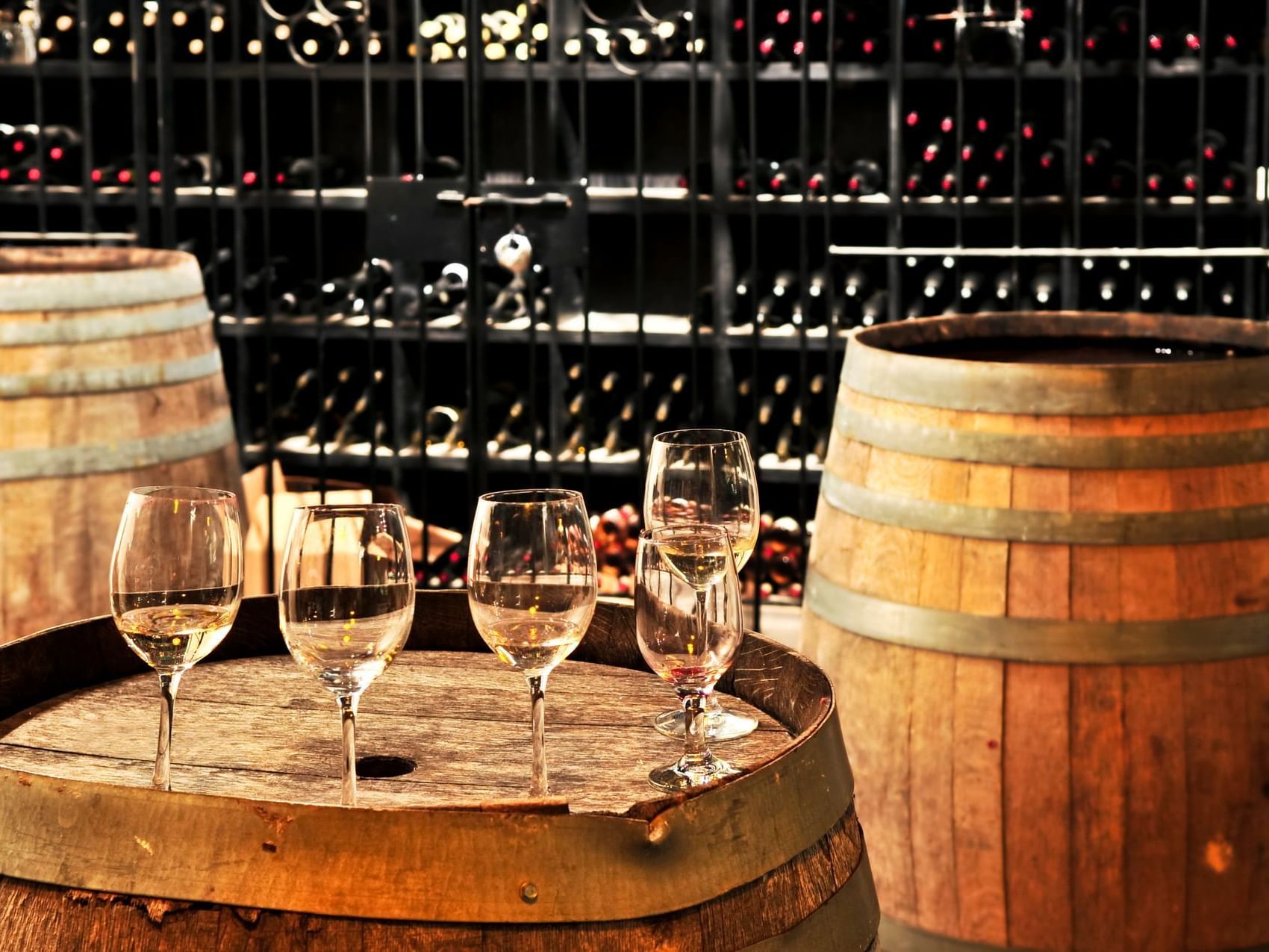 Wine glasses on an oak barrel at ICONA Hotel Windriff