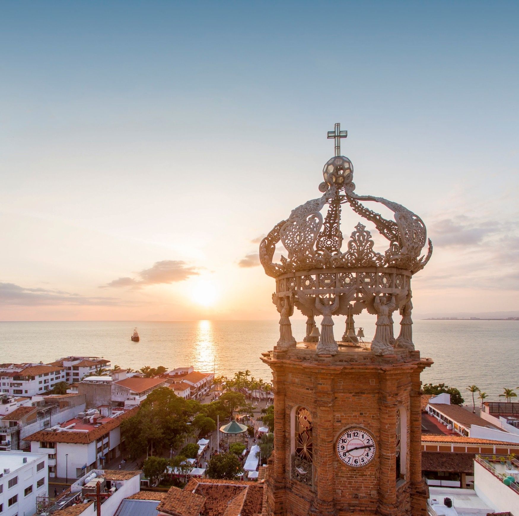 Aerial sunset view from the Parish of Our Lady of Guadalupe in Puerto Vallarta during whale season, overlooking the Pacific Ocean.