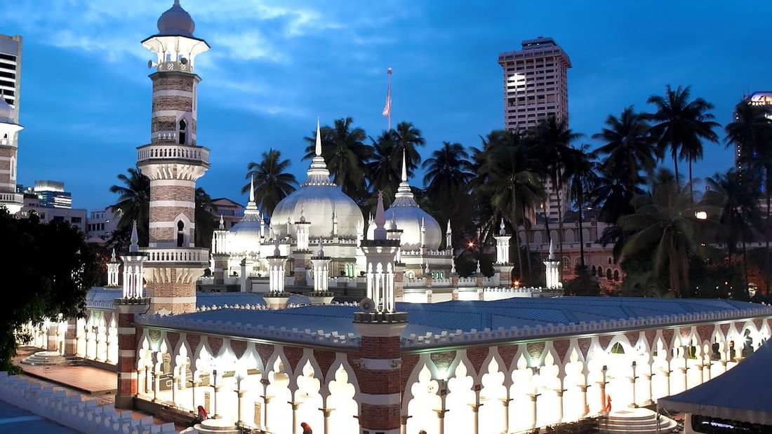 Exterior view of Masjid Jamek near Sunway Velocity Hotel at nighttime