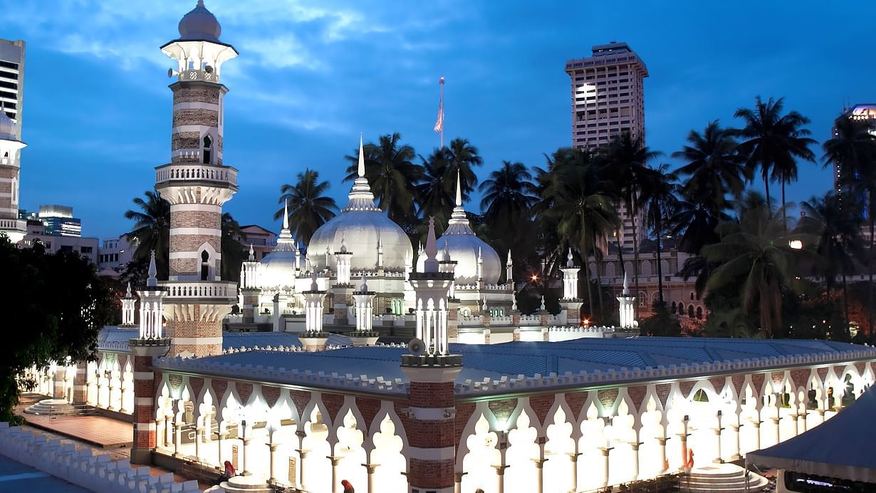 Exterior view of Masjid Jamek near Sunway Velocity Hotel at nighttime