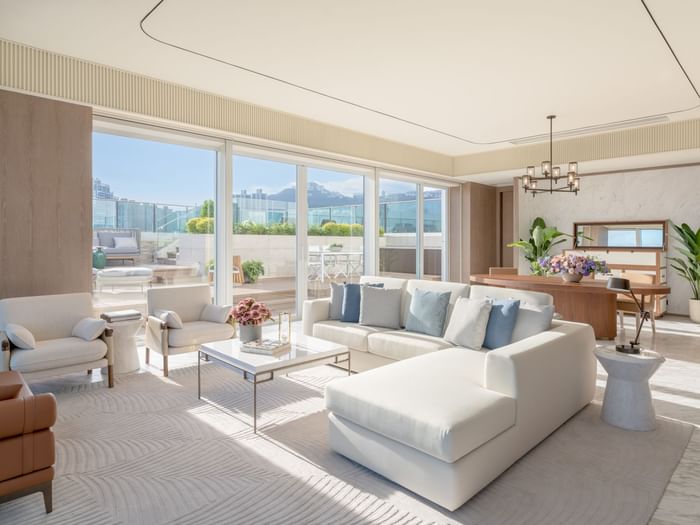 Living area with sofas in The Fullerton Pool Suite at Fullerton Ocean Park Hotel Hong Kong