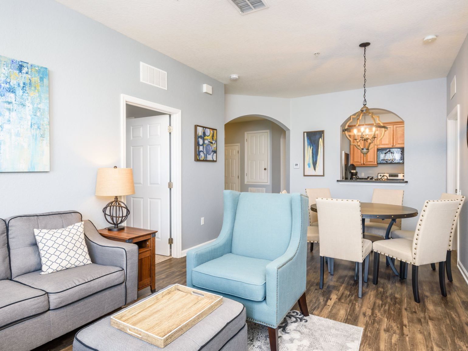 Open-concept living and dining area with modern furnishings in Deluxe 3 Bedroom/ 2 Bath Condo at Vista Cay Resort By Millenium.