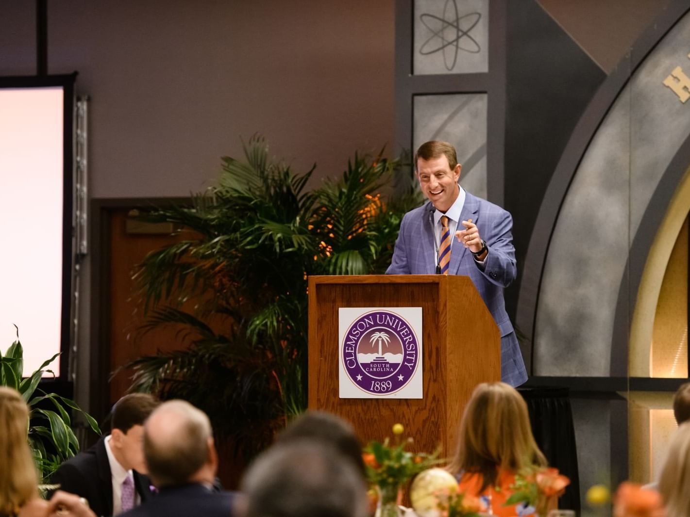 Dabo Sweeney at podium giving speech