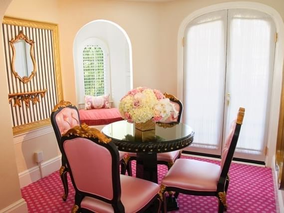 Dining room with pink chairs at Mission Inn Riverside