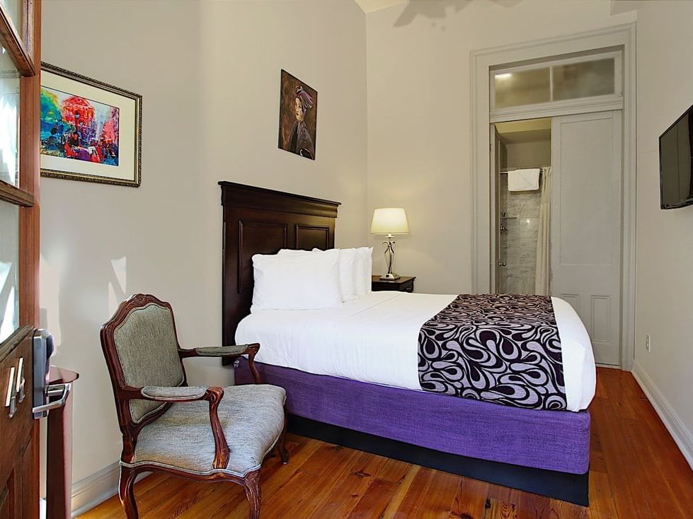 Chair & Bed in Full Deluxe room, French Quarter Guesthouses