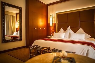 Close up on the king bed in a room at Hotel Sumaq