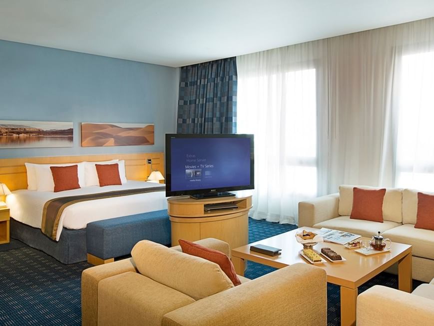 Bed & furniture in Junior Suite at City Season Hotels