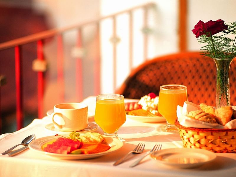 Table arranged with breakfast & drinks at Fiesta Inn Hotels