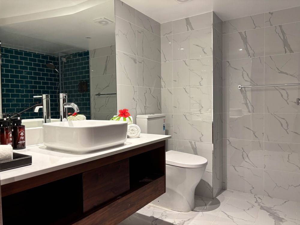Modern white bathroom with sink and toilet at Warwick Fiji Korolevu.