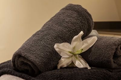 Close-up of a Spa towel and a flower at Orsett Hall Hotel