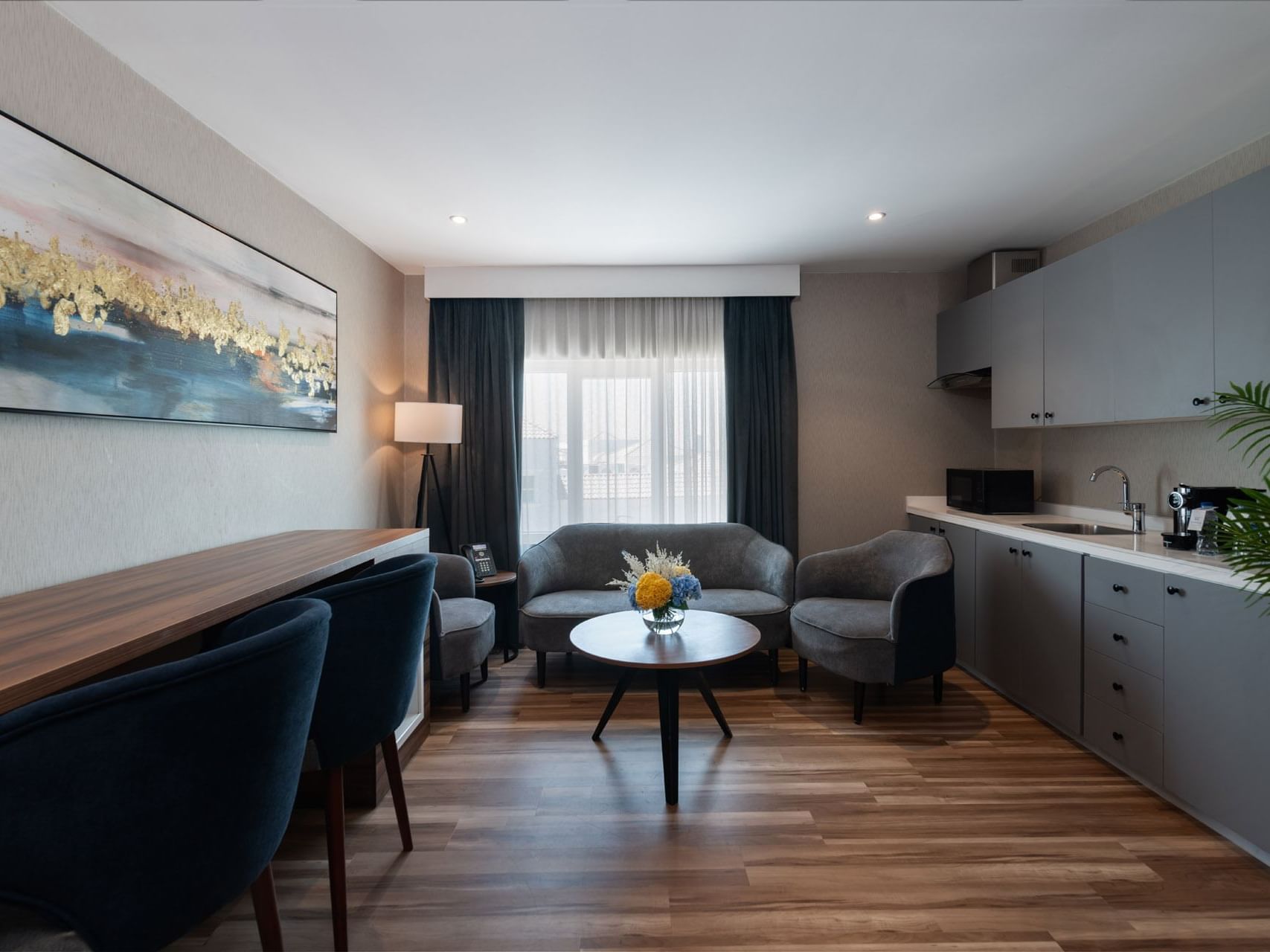 Living and kitchenette area in Junior Suite Sea View at Warwick Hotels & Resorts