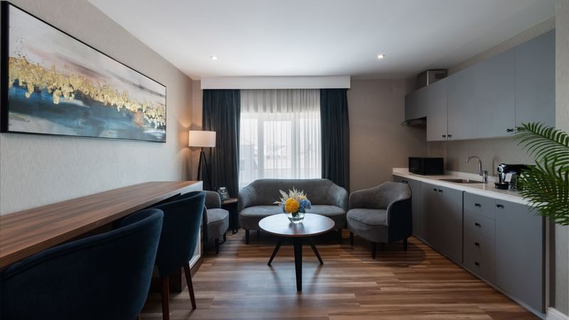 Living and kitchenette area in Junior Suite Sea View at Warwick Hotels & Resorts