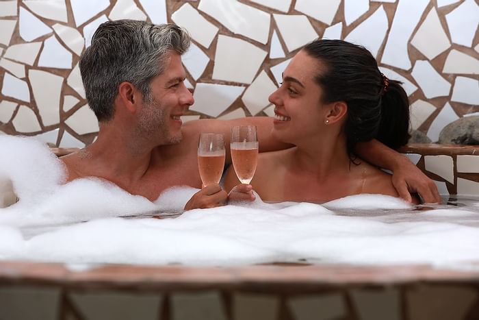 Couple on bathtub in Nanku Wellbeing Spa at Punta Islita Hotel