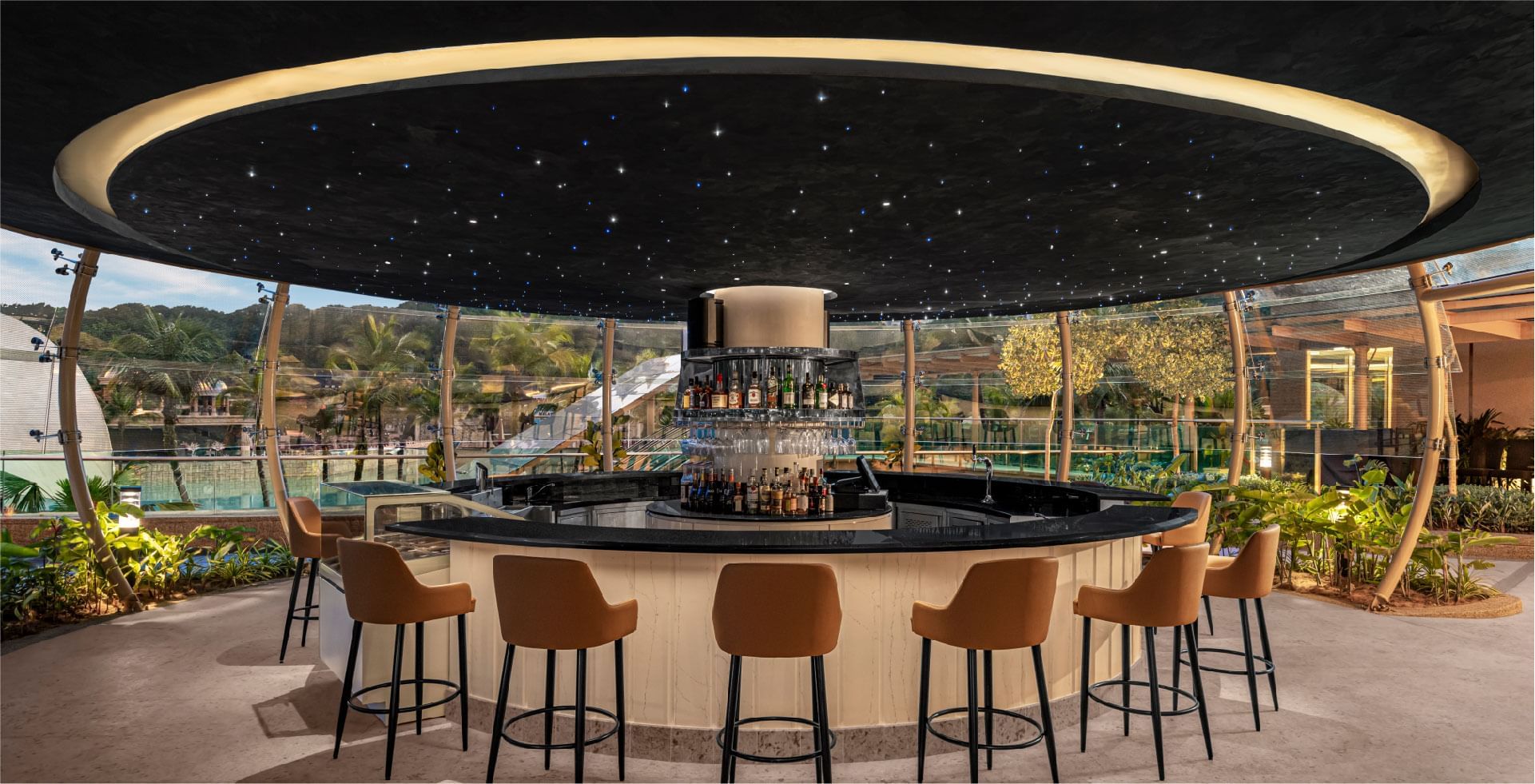 Stylish circular bar at Sunway resort, featuring a starry ceiling and a wide array of liquor bottles