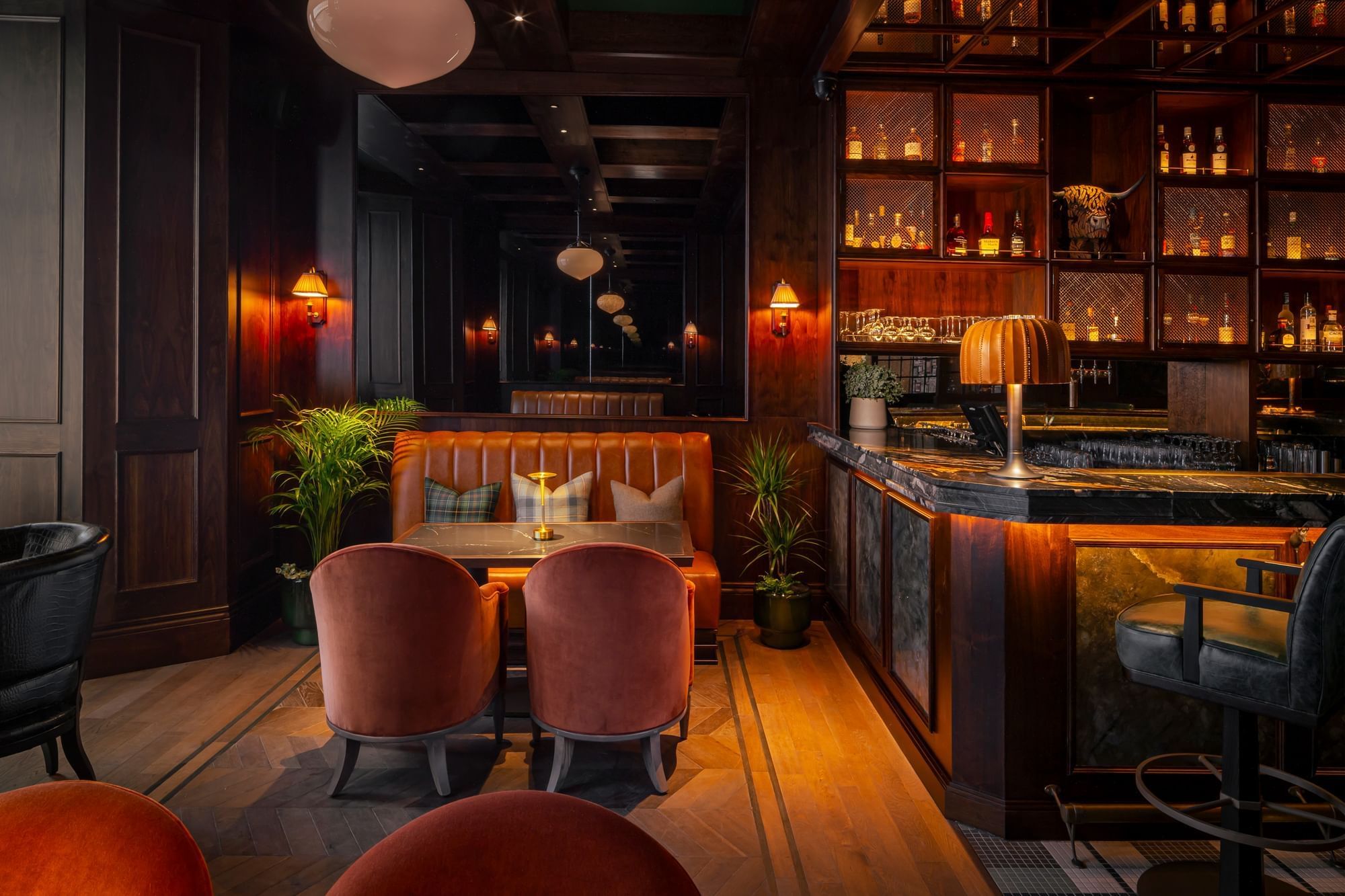 Bow Butts Bar with a leather booth, plush chairs by the well-stocked bar at Seaton House