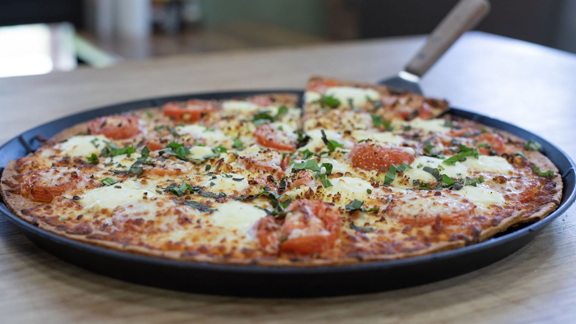 Close-up of Pizza served in Bruno’s Pizza at Watersound Inn