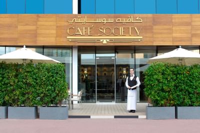 Entrance of cafe society with greeter at Tamani Marina Hotel 