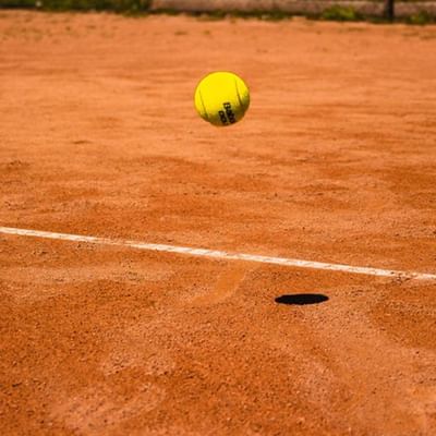 A tennis ball hitting the court at  Falkensteiner Hotel Iadera